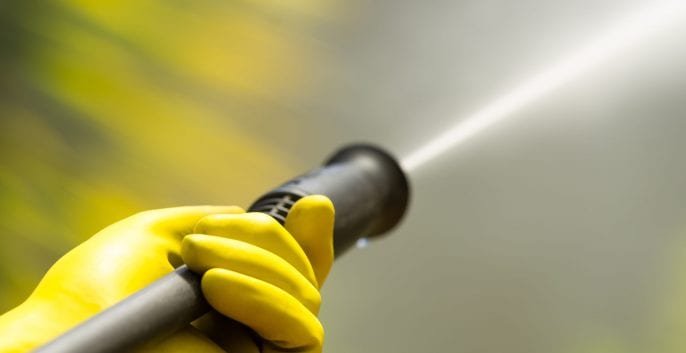Power washing a home exterior